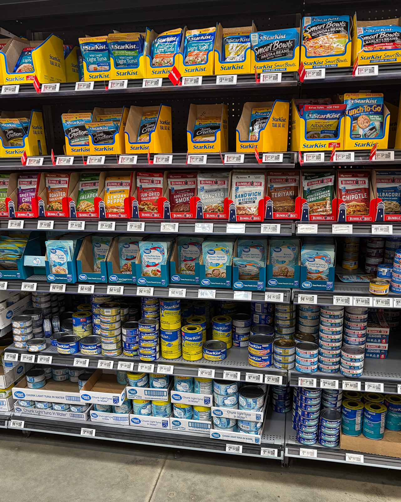 Canned tuna and convenient protein options displayed in a grocery store aisle