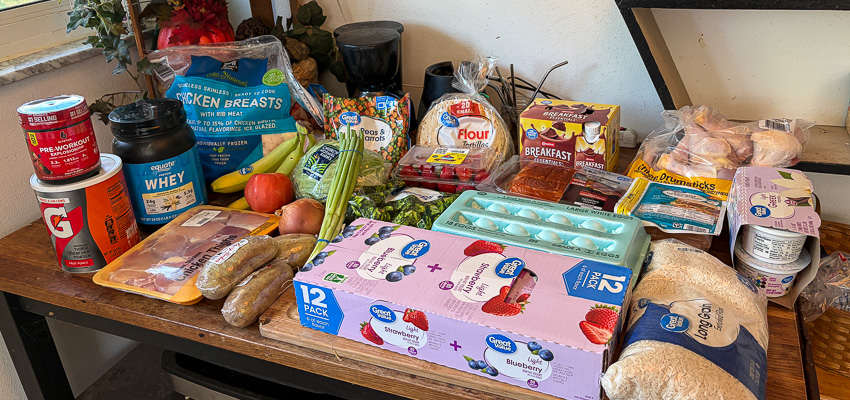 Grocery haul with protein, fruits, vegetables, and carbohydrates for muscle gain and fat loss